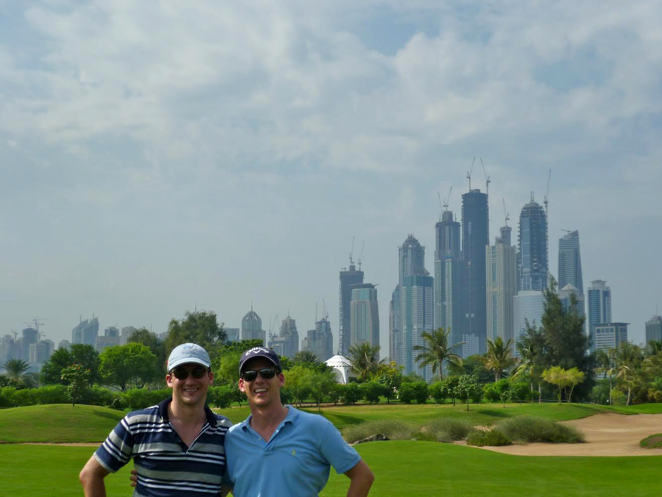 Us on the golf course with Dubai in the background
